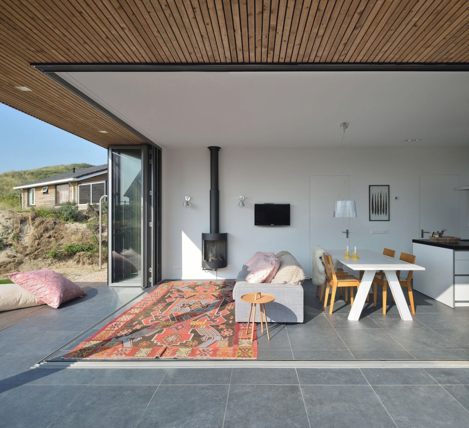 This vacation cottage sits on the sand dunes of a Dutch coastal island. It has two small bedrooms in 646 sq ft. | www.facebook.com/SmallHouseBliss