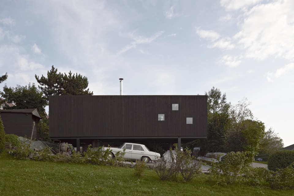 This small house sits at the edge of a pond surrounded by mature landscaping. It has one bedroom in 538 sq ft. | www.facebook.com/SmallHouseBliss