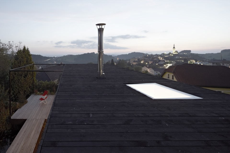 This small house sits at the edge of a pond surrounded by mature landscaping. It has one bedroom in 538 sq ft. | www.facebook.com/SmallHouseBliss