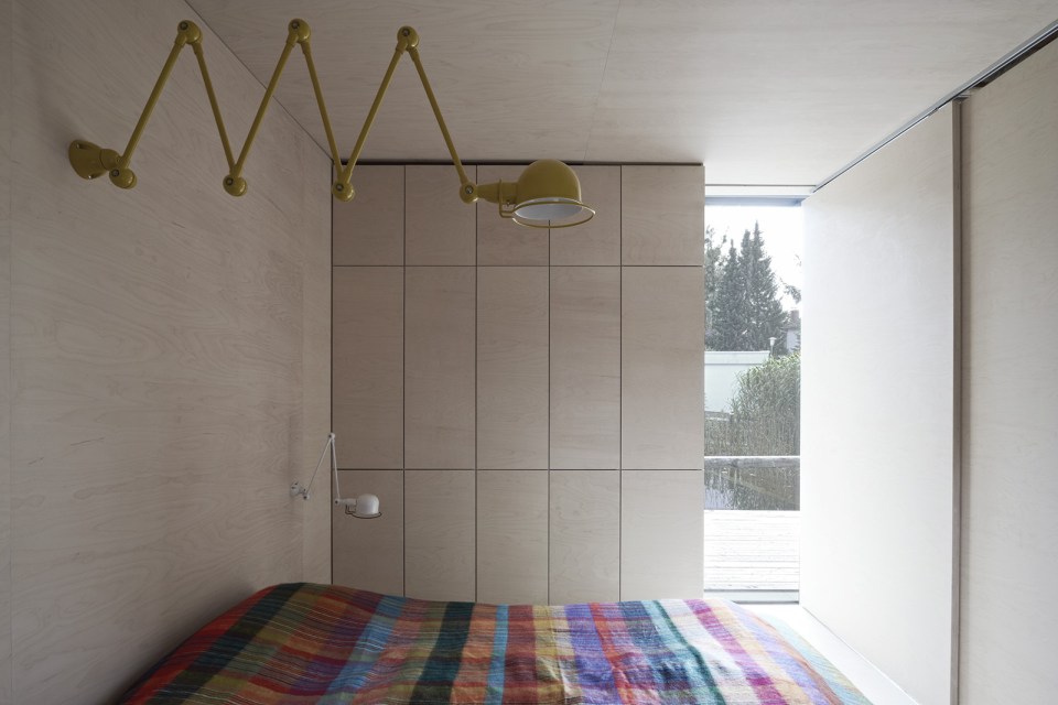 This small house sits at the edge of a pond surrounded by mature landscaping. It has one bedroom in 538 sq ft. | www.facebook.com/SmallHouseBliss