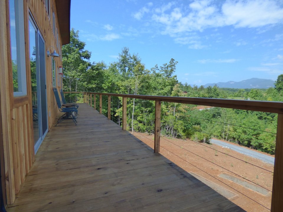 A modern cabin in the hills of North Carolina. It has one bedroom on the 704 sq ft ground floor plus a loft. | www.facebook.com/SmallHouseBliss