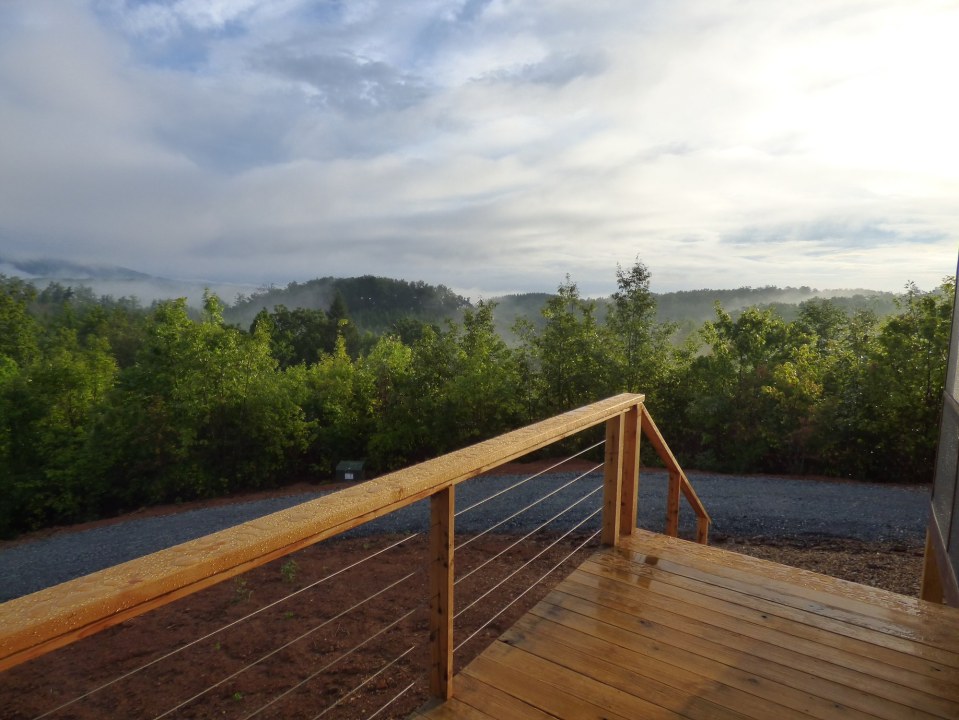 A modern cabin in the hills of North Carolina. It has one bedroom on the 704 sq ft ground floor plus a loft. | www.facebook.com/SmallHouseBliss