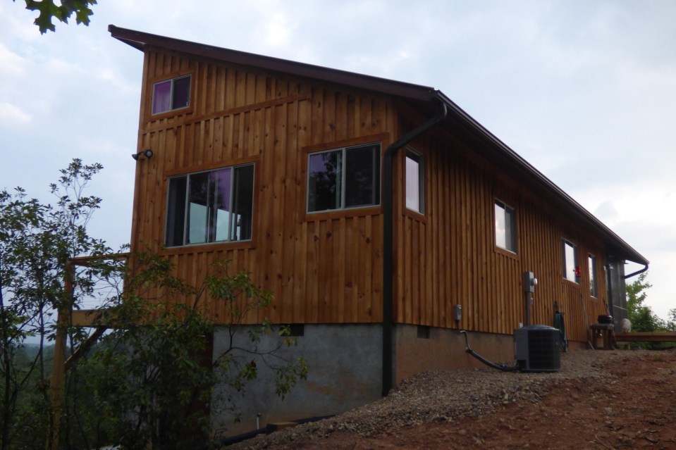 A modern cabin in the hills of North Carolina. It has one bedroom on the 704 sq ft ground floor plus a loft. | www.facebook.com/SmallHouseBliss