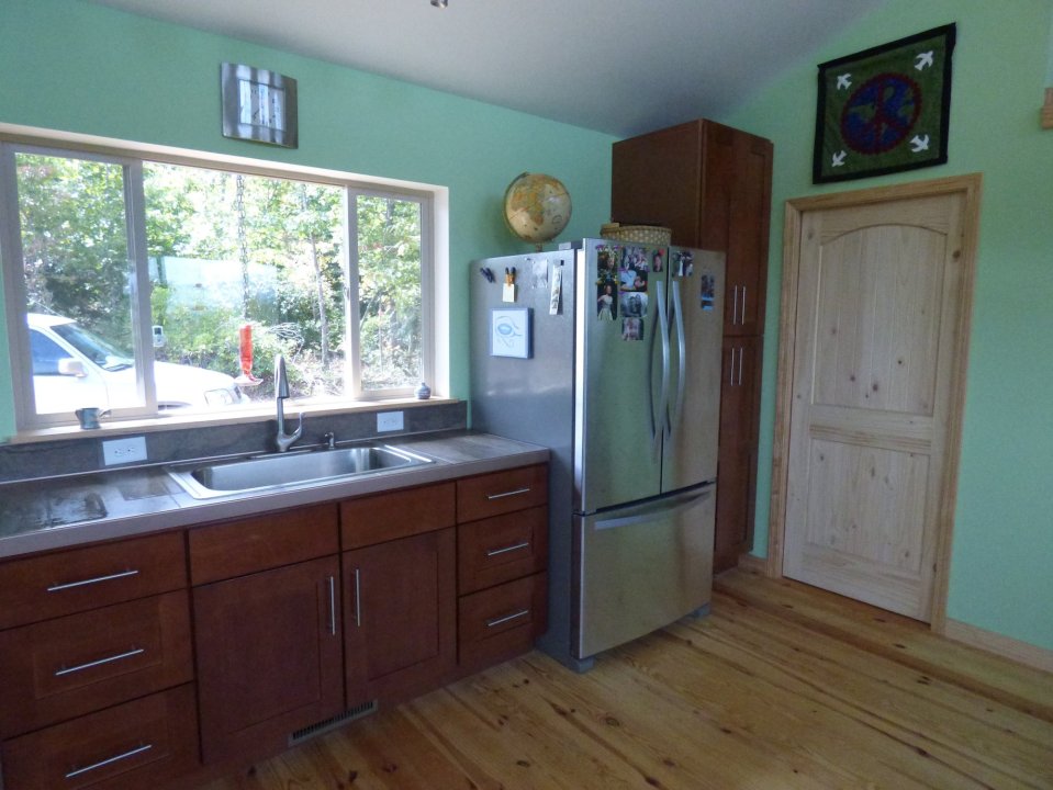 A modern cabin in the hills of North Carolina. It has one bedroom on the 704 sq ft ground floor plus a loft. | www.facebook.com/SmallHouseBliss