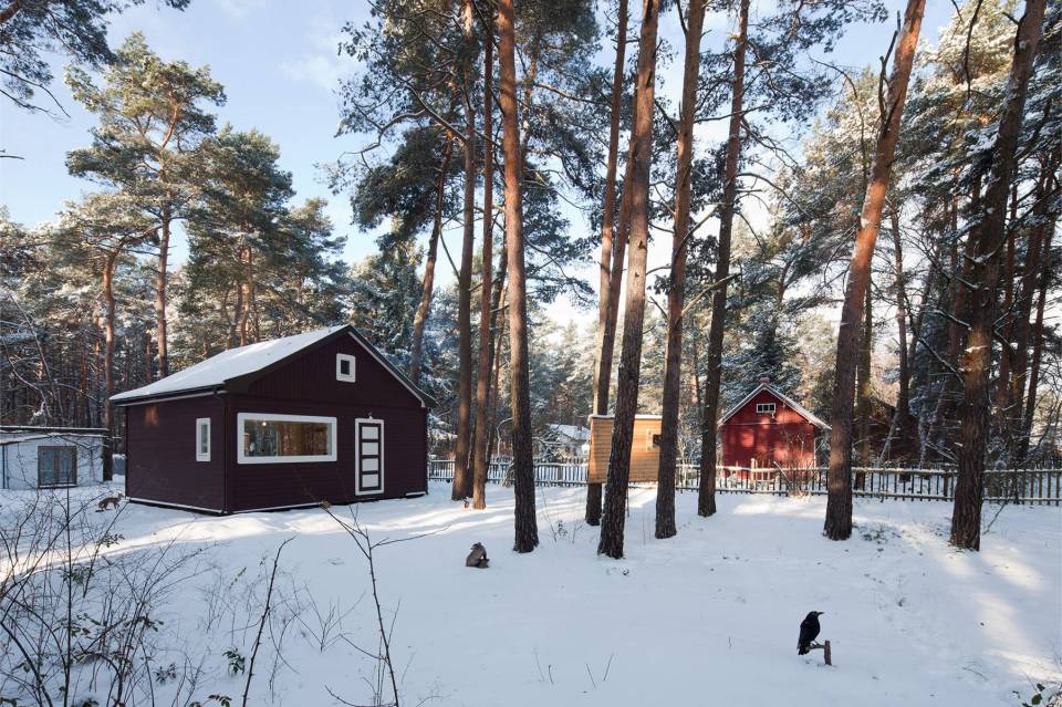 A small "gingerbread house" in the forest. The 667 sq ft cottage has a loft divided into two sleeping spaces. | www.facebook.com/SmallHouseBliss