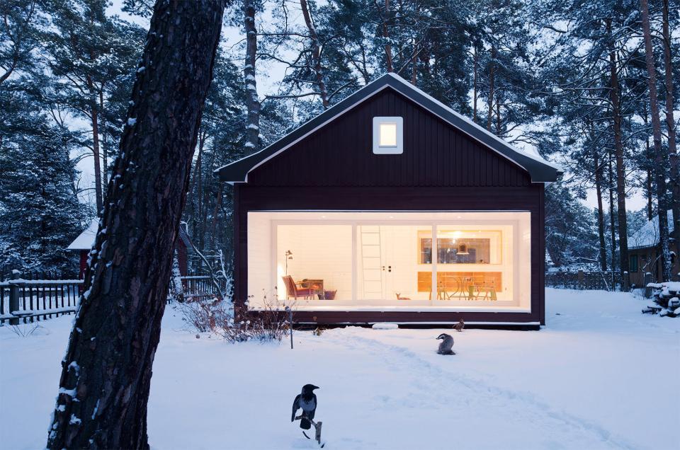 A small "gingerbread house" in the forest. The 667 sq ft cottage has a loft divided into two sleeping spaces. | www.facebook.com/SmallHouseBliss