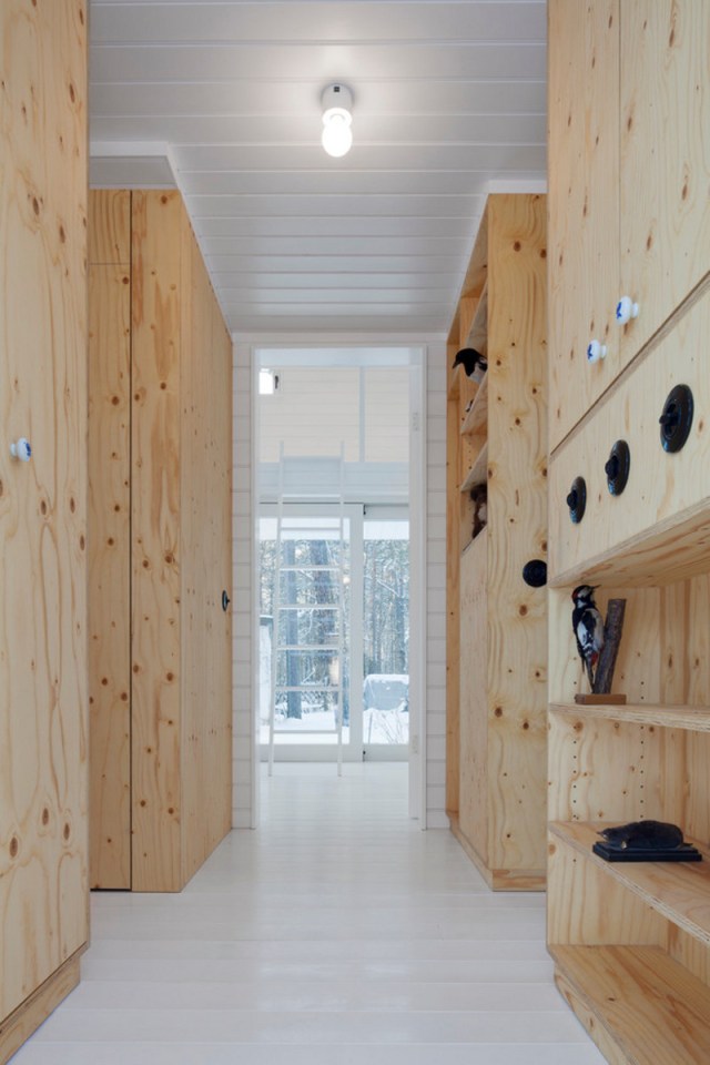 A small "gingerbread house" in the forest. The 667 sq ft cottage has a loft divided into two sleeping spaces. | www.facebook.com/SmallHouseBliss