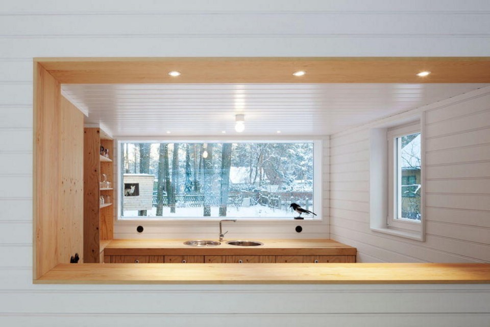 A small "gingerbread house" in the forest. The 667 sq ft cottage has a loft divided into two sleeping spaces. | www.facebook.com/SmallHouseBliss