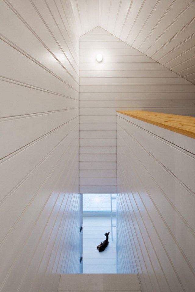 A small "gingerbread house" in the forest. The 667 sq ft cottage has a loft divided into two sleeping spaces. | www.facebook.com/SmallHouseBliss