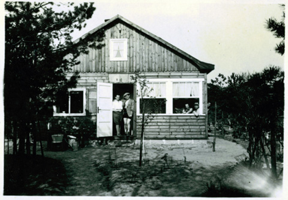 A small "gingerbread house" in the forest. The 667 sq ft cottage has a loft divided into two sleeping spaces. | www.facebook.com/SmallHouseBliss