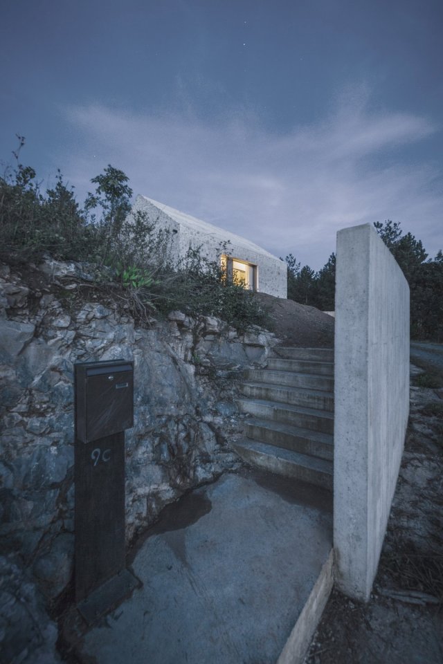 This stone and concrete cottage is an update of traditional stone houses in the area. Designed for a family of 4, the house has 2 bedrooms in 990 sq ft. | www.facebook.com/SmallHouseBliss