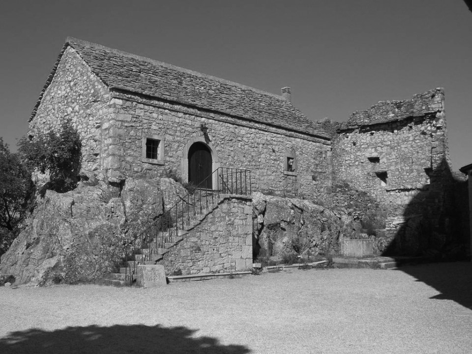 This stone and concrete cottage is an update of traditional stone houses in the area. Designed for a family of 4, the house has 2 bedrooms in 990 sq ft. | www.facebook.com/SmallHouseBliss
