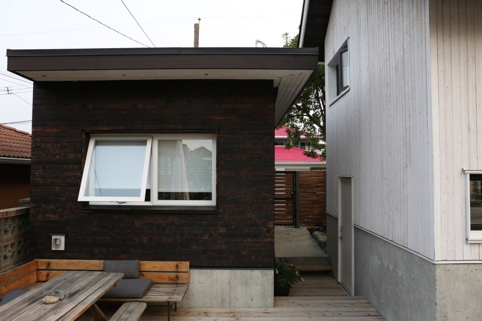 Magnolia Tree Lane House, a stylish new laneway house, has a reverse floor plan with 1 bedroom in 670 sq ft. | www.facebook.com/SmallHouseBliss