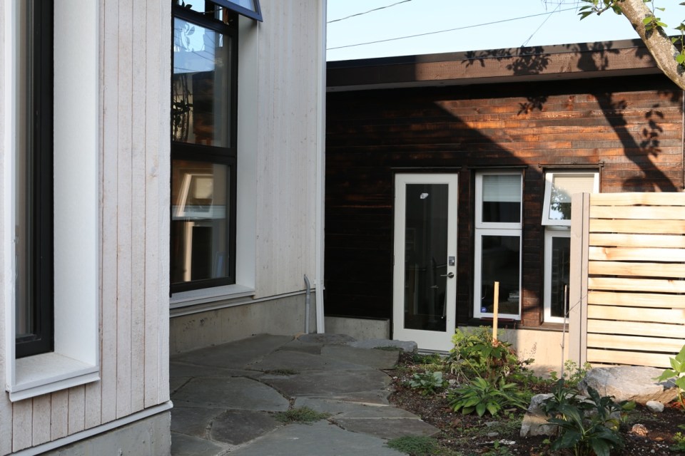 Magnolia Tree Lane House, a stylish new laneway house, has a reverse floor plan with 1 bedroom in 670 sq ft. | www.facebook.com/SmallHouseBliss