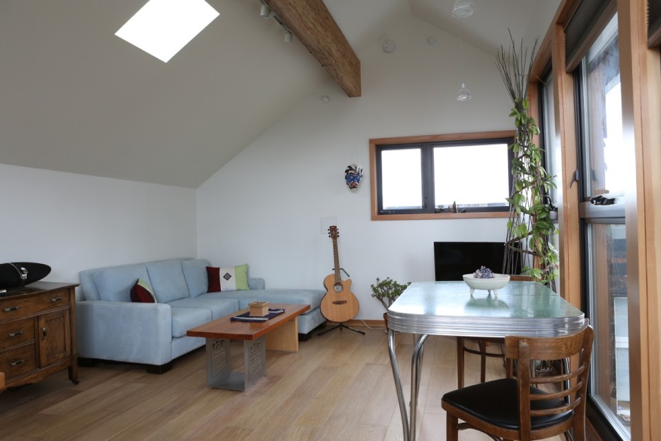 Magnolia Tree Lane House, a stylish new laneway house, has a reverse floor plan with 1 bedroom in 670 sq ft. | www.facebook.com/SmallHouseBliss