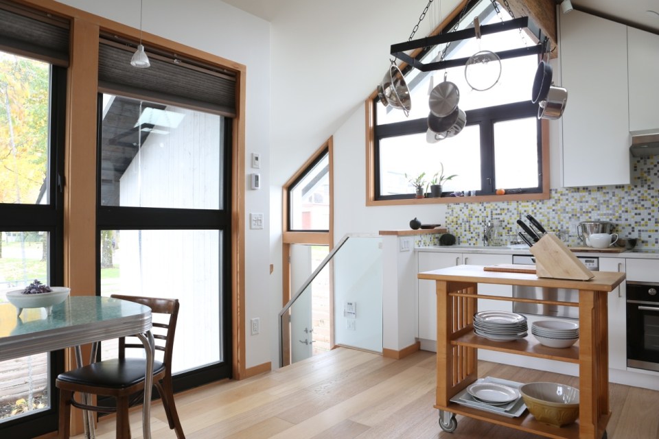 Magnolia Tree Lane House, a stylish new laneway house, has a reverse floor plan with 1 bedroom in 670 sq ft. | www.facebook.com/SmallHouseBliss