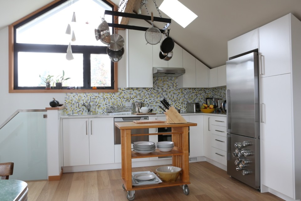 Magnolia Tree Lane House, a stylish new laneway house, has a reverse floor plan with 1 bedroom in 670 sq ft. | www.facebook.com/SmallHouseBliss