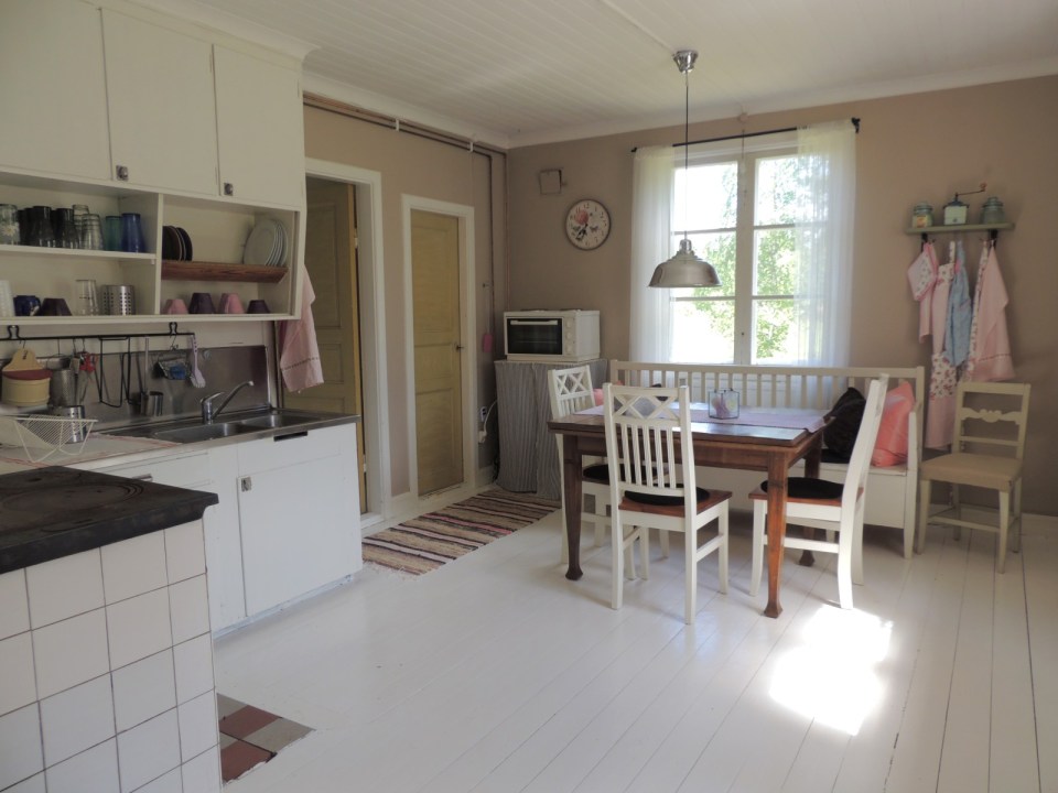 This hundred-year-old farmhouse in the Swedish countryside retains much of its original interior and character. It has 3 bedrooms in roughly 1,020 sq ft. | www.facebook.com/SmallHouseBliss