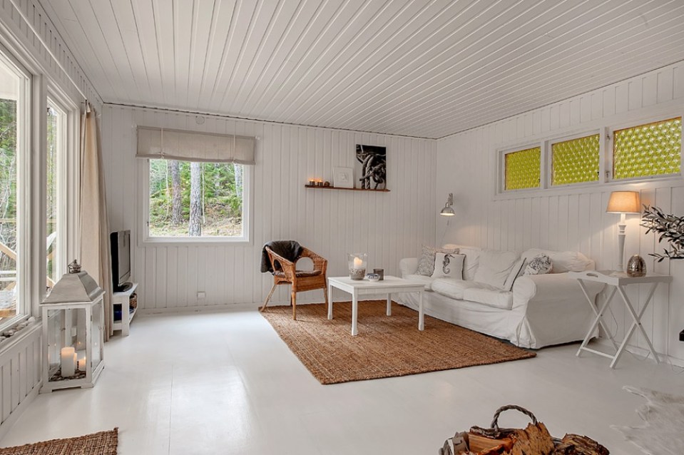 This simple cottage in the Swedish countryside has 2 bedrooms. A monochromatic color scheme makes it appear more spacious than its 614 sq ft. | www.facebook.com/SmallHouseBliss