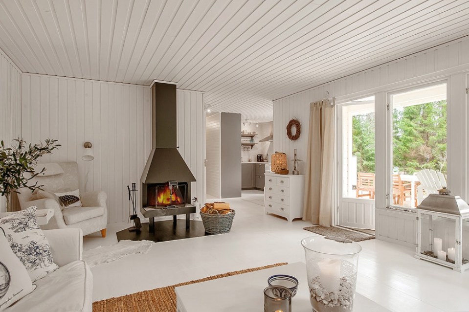 This simple cottage in the Swedish countryside has 2 bedrooms. A monochromatic color scheme makes it appear more spacious than its 614 sq ft. | www.facebook.com/SmallHouseBliss