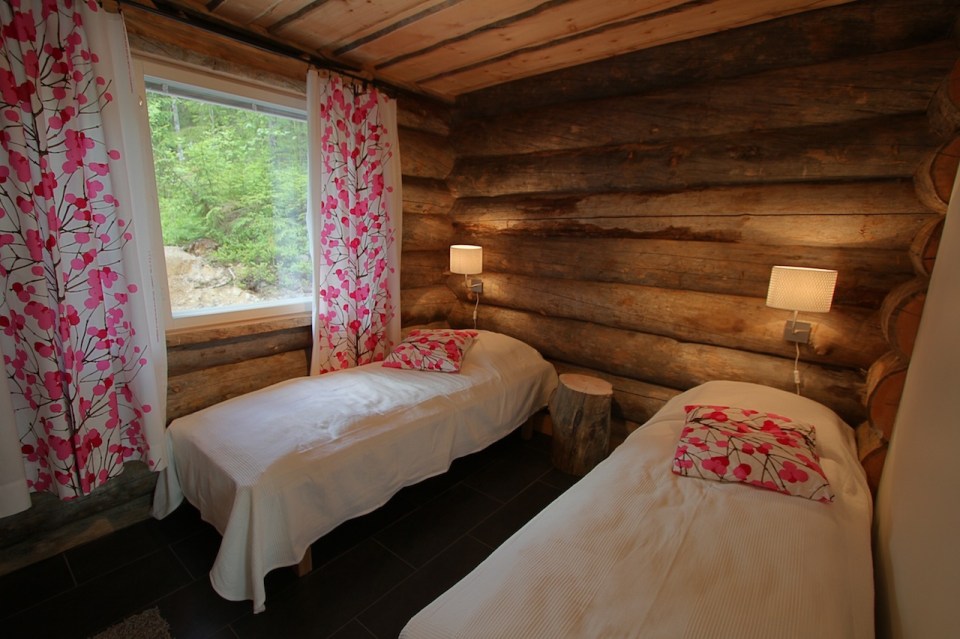 This modern log cabin in Finland has two bedrooms and a den in 969 sq ft. | www.facebook.com/SmallHouseBliss