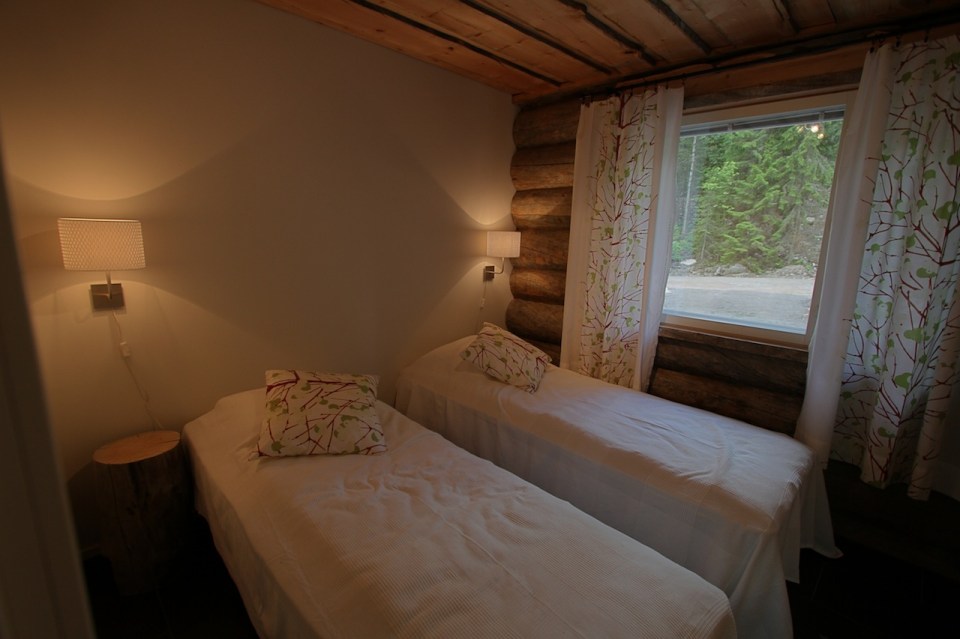 This modern log cabin in Finland has two bedrooms and a den in 969 sq ft. | www.facebook.com/SmallHouseBliss