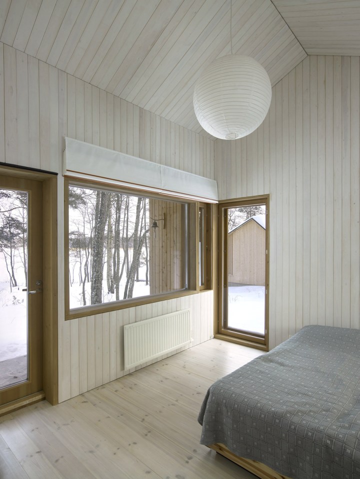 This small family vacation cabin combines a dogtrot floor plan with a Nordic design aesthetic. | www.facebook.com/SmallHouseBliss