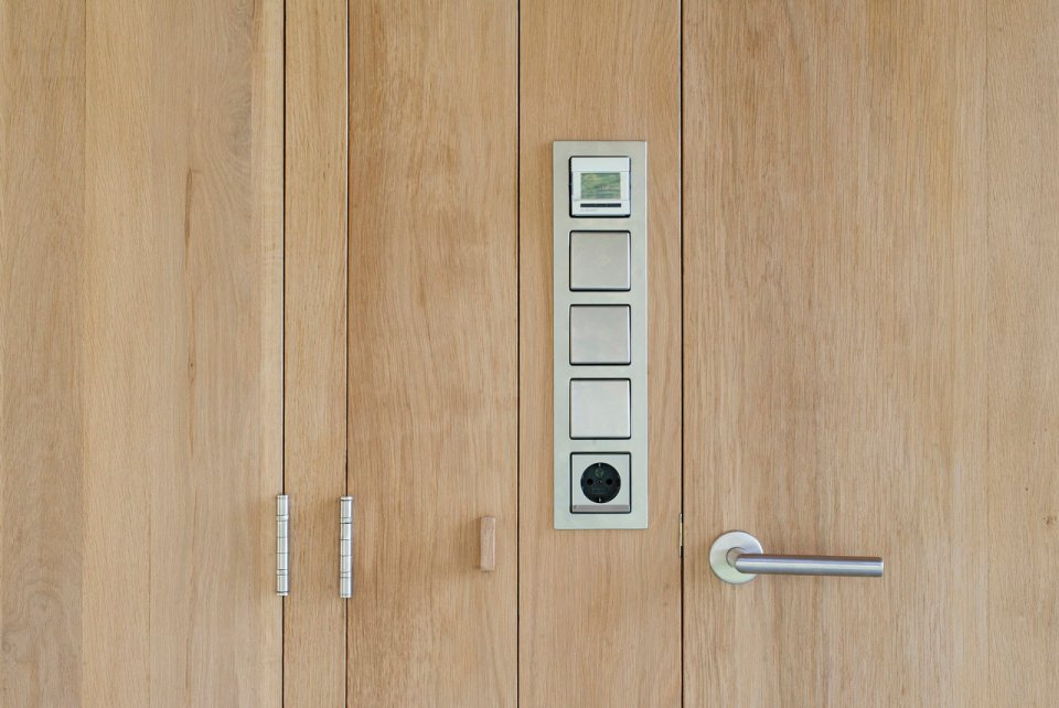 This tiny vacation cottage opens to the garden with a wall of shutters. Built-in cabinetry houses the bathroom, fireplace and kitchen. | www.facebook.com/SmallHouseBliss