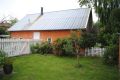 This cottage in Denmark opens to a lushly-planted garden. It is 861 sq ft with a loft bedroom and the potential for a second bedroom downstairs. | www.facebook.com/SmallHouseBliss