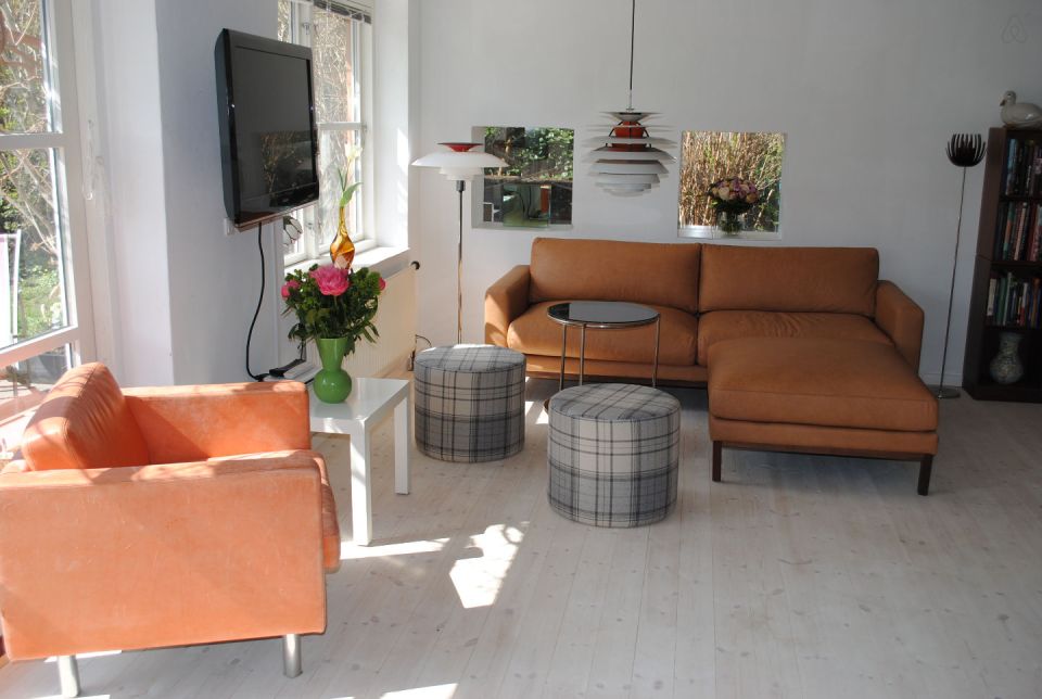 This cottage in Denmark opens to a lushly-planted garden. It is 861 sq ft with a loft bedroom and the potential for a second bedroom downstairs. | www.facebook.com/SmallHouseBliss