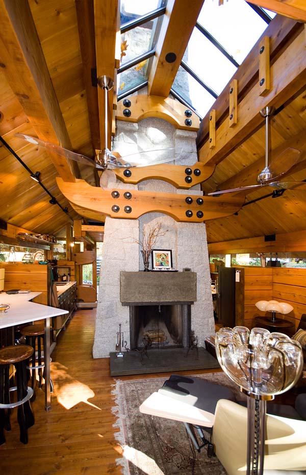 "The Totems" is a small log cabin with an almost mystical quality. It has 400 sq ft plus a sleeping loft. | www.facebook.com/SmallHouseBliss