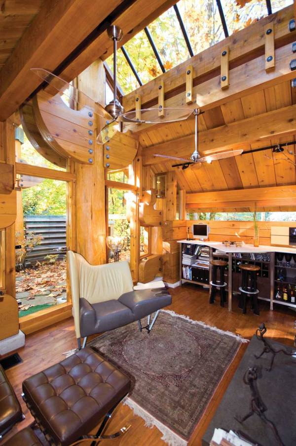 "The Totems" is a small log cabin with an almost mystical quality. It has 400 sq ft plus a sleeping loft. | www.facebook.com/SmallHouseBliss