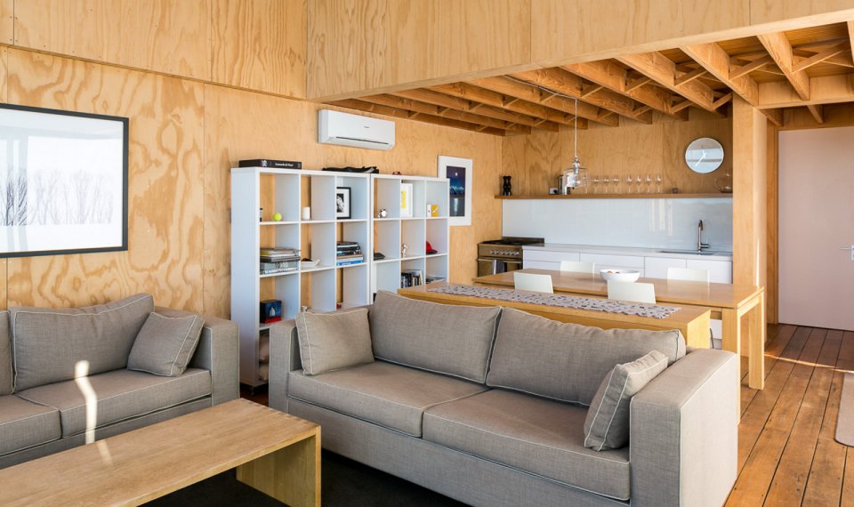 This New Zealand "bach" (a simple vacation home) has a 592 sq ft main level plus two attic loft bedrooms. | www.facebook.com/SmallHouseBliss