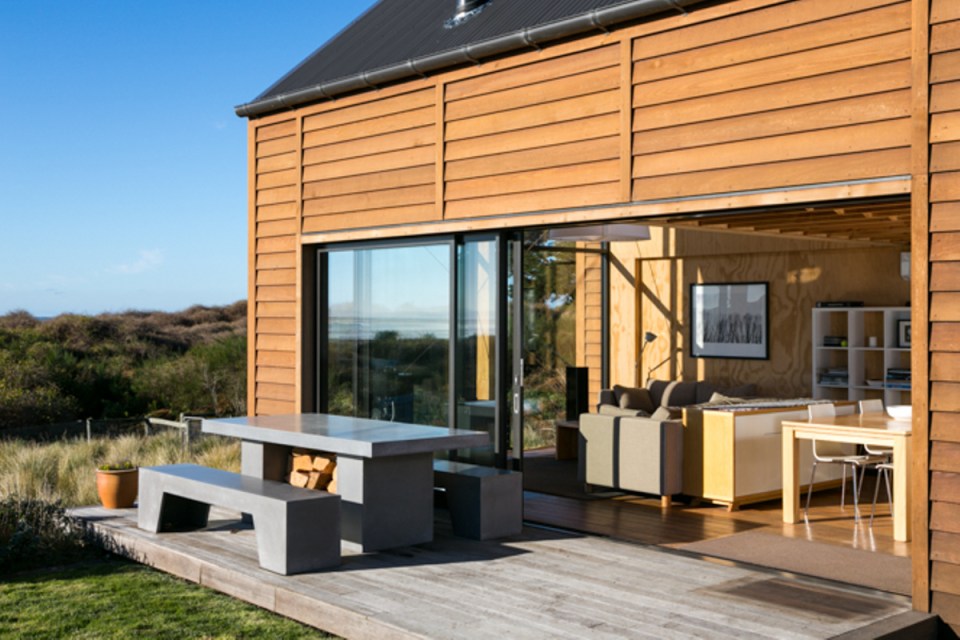 This New Zealand "bach" (a simple vacation home) has a 592 sq ft main level plus two attic loft bedrooms. | www.facebook.com/SmallHouseBliss