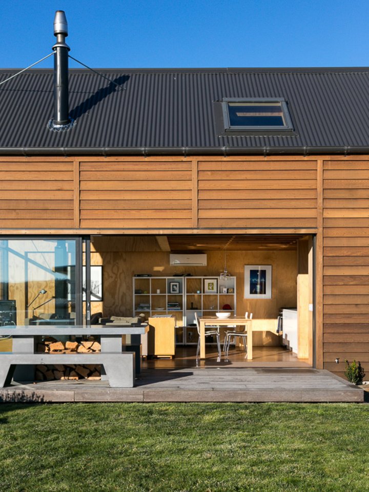 This New Zealand "bach" (a simple vacation home) has a 592 sq ft main level plus two attic loft bedrooms. | www.facebook.com/SmallHouseBliss
