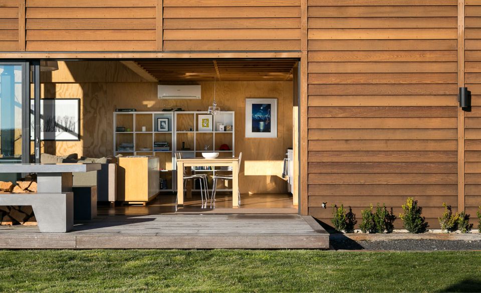 This New Zealand "bach" (a simple vacation home) has a 592 sq ft main level plus two attic loft bedrooms. | www.facebook.com/SmallHouseBliss