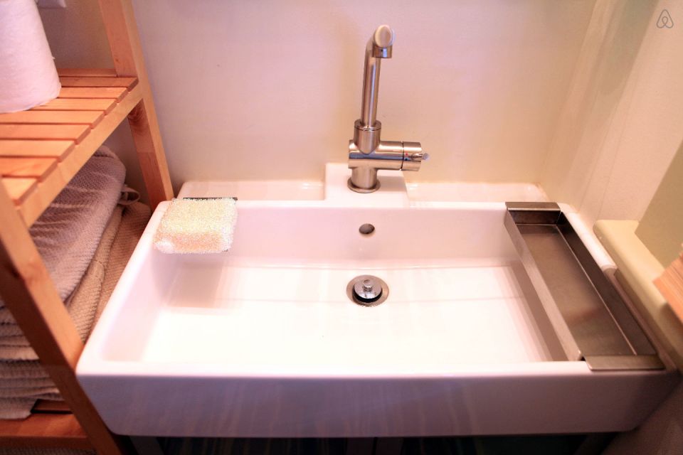 This tiny backyard cottage in Portland, Oregon, is likely a converted garage. It has 300 sq ft plus a sleeping loft. | www.facebook.com/SmallHouseBliss