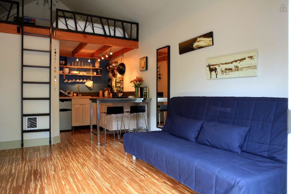 This tiny backyard cottage in Portland, Oregon, is likely a converted garage. It has 300 sq ft plus a sleeping loft. | www.facebook.com/SmallHouseBliss