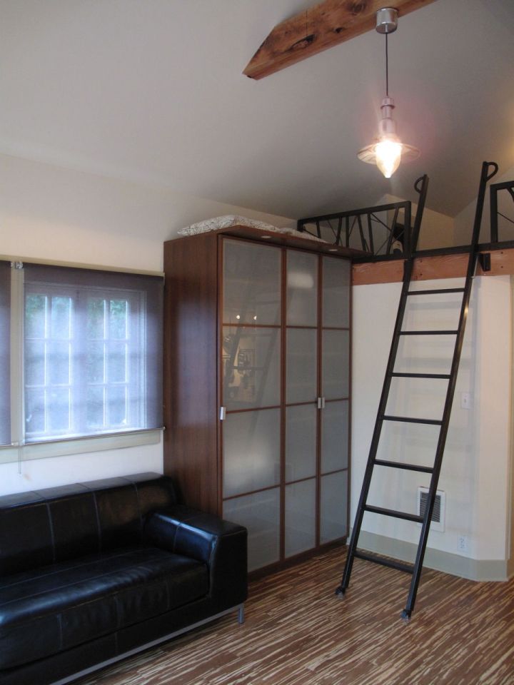 This tiny backyard cottage in Portland, Oregon, is likely a converted garage. It has 300 sq ft plus a sleeping loft. | www.facebook.com/SmallHouseBliss