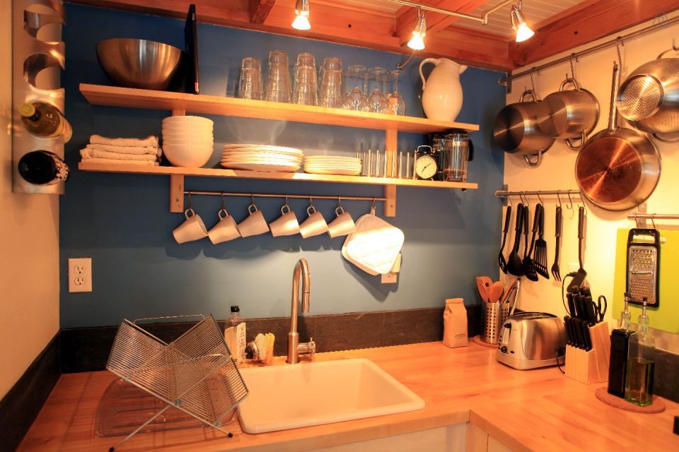 This tiny backyard cottage in Portland, Oregon, is likely a converted garage. It has 300 sq ft plus a sleeping loft. | www.facebook.com/SmallHouseBliss