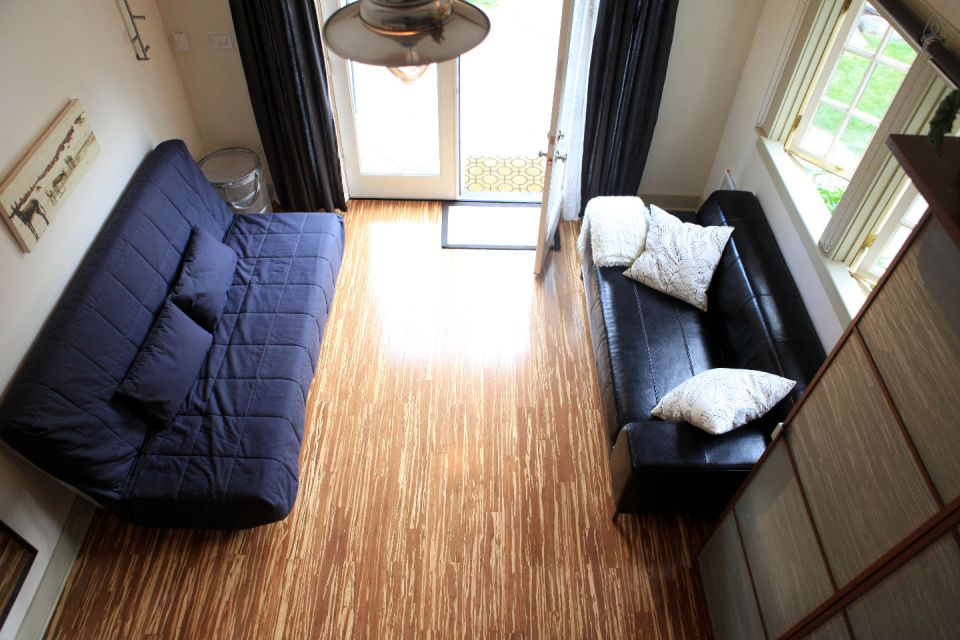 This tiny backyard cottage in Portland, Oregon, is likely a converted garage. It has 300 sq ft plus a sleeping loft. | www.facebook.com/SmallHouseBliss