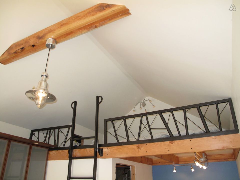 This tiny backyard cottage in Portland, Oregon, is likely a converted garage. It has 300 sq ft plus a sleeping loft. | www.facebook.com/SmallHouseBliss