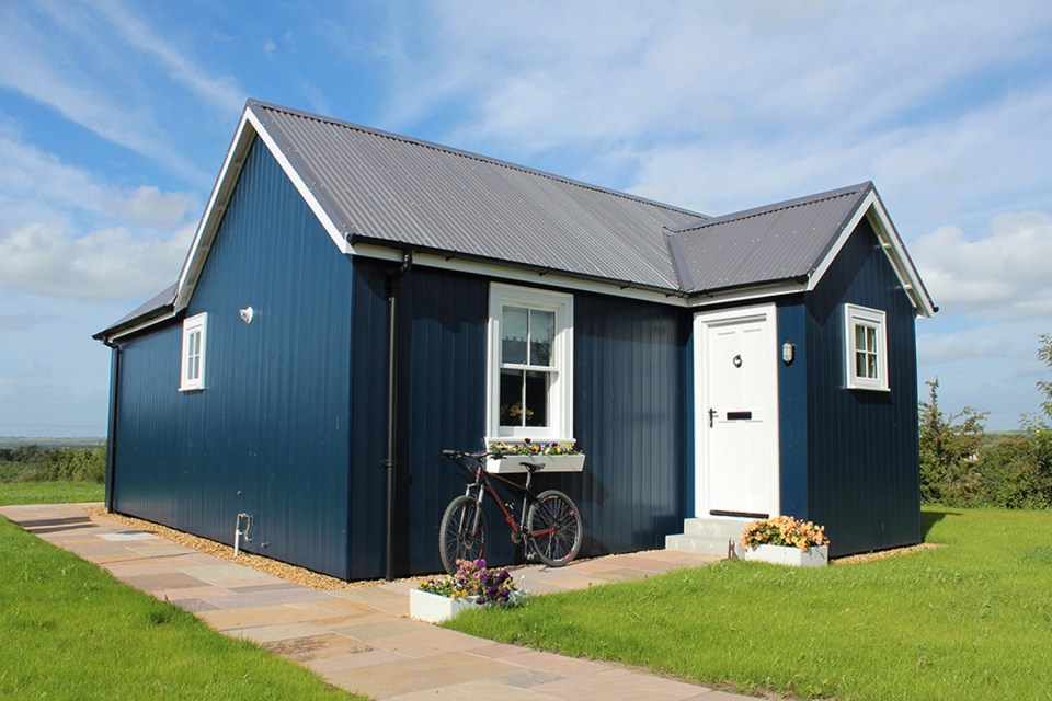 A small traditionally-styled Scottish house by modular builder The Wee House Company. This model has one bedroom in 431 sq ft. | www.facebook.com/SmallHouseBliss