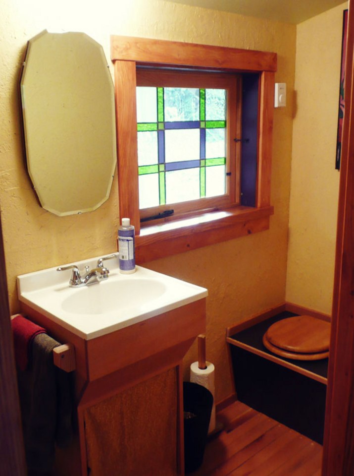 Artwood Cottage, a cozy hideaway in the woods, features hand-plastered walls and custom woodwork. It has one lofted bedroom. | www.facebook.com/SmallHouseBliss