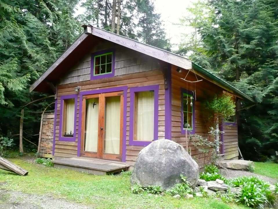 Artwood Cottage, a cozy hideaway in the woods, features hand-plastered walls and custom woodwork. It has one lofted bedroom. | www.facebook.com/SmallHouseBliss