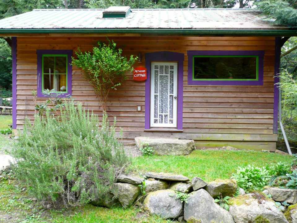 Artwood Cottage, a cozy hideaway in the woods, features hand-plastered walls and custom woodwork. It has one lofted bedroom. | www.facebook.com/SmallHouseBliss