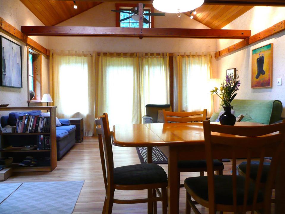 Artwood Cottage, a cozy hideaway in the woods, features hand-plastered walls and custom woodwork. It has one lofted bedroom. | www.facebook.com/SmallHouseBliss