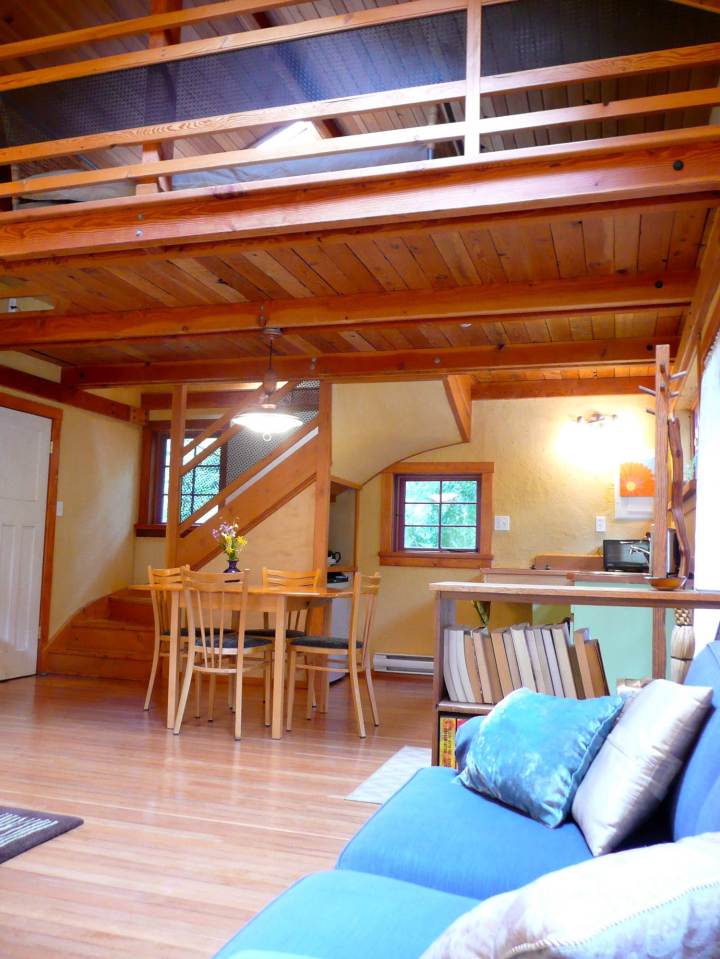 Artwood Cottage, a cozy hideaway in the woods, features hand-plastered walls and custom woodwork. It has one lofted bedroom. | www.facebook.com/SmallHouseBliss