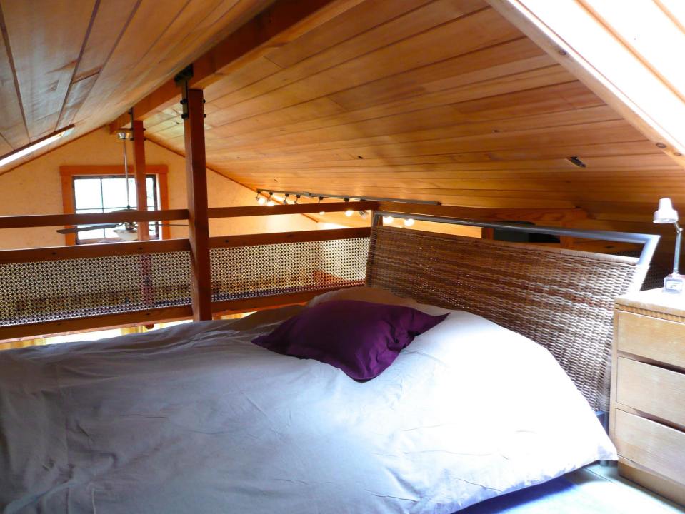 Artwood Cottage, a cozy hideaway in the woods, features hand-plastered walls and custom woodwork. It has one lofted bedroom. | www.facebook.com/SmallHouseBliss