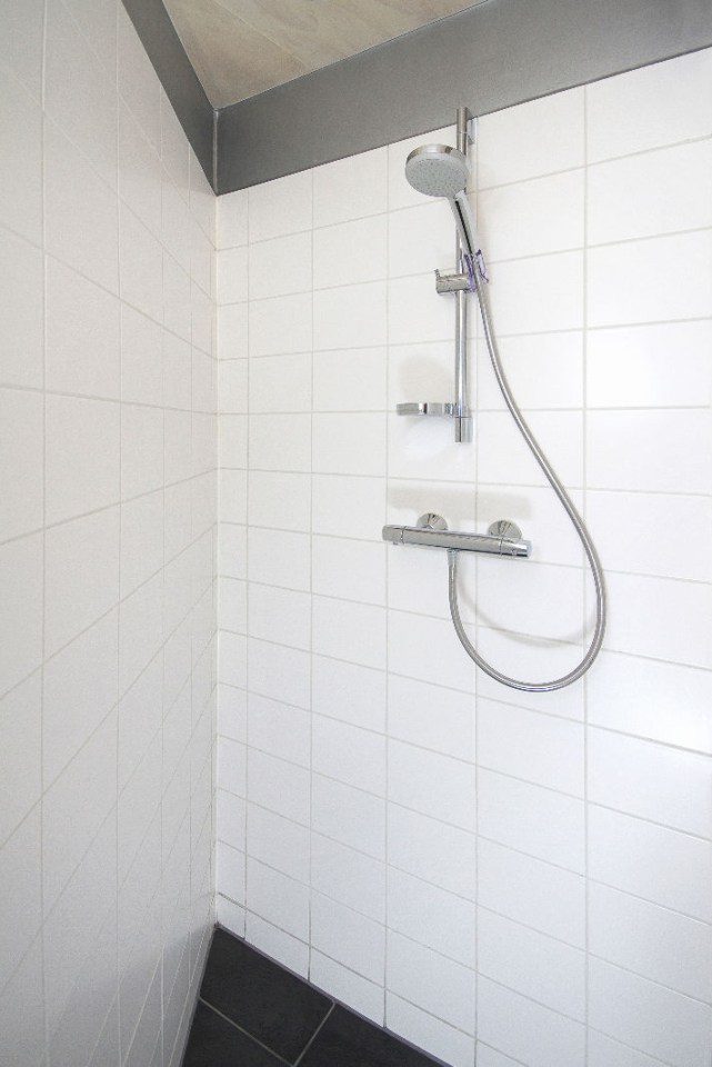 "Forest House" is a yurt-like tiny cottage with rafters radiating out from the center and an open studio floor plan. | www.facebook.com/SmallHouseBliss